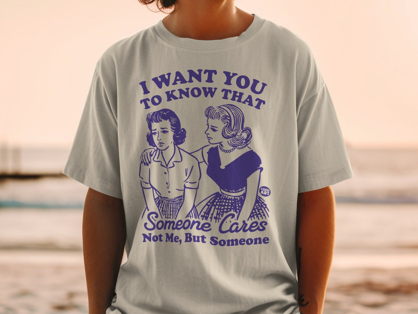 T-shirt with a graphic of two women and text "I want you to know that someone cares".