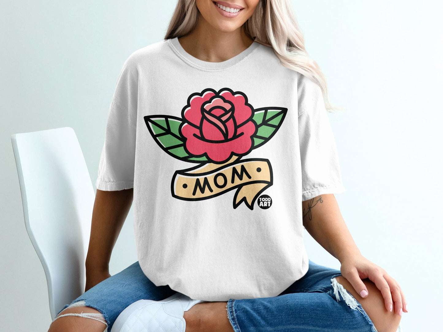 White t-shirt with a red rose and "Mom" banner design.