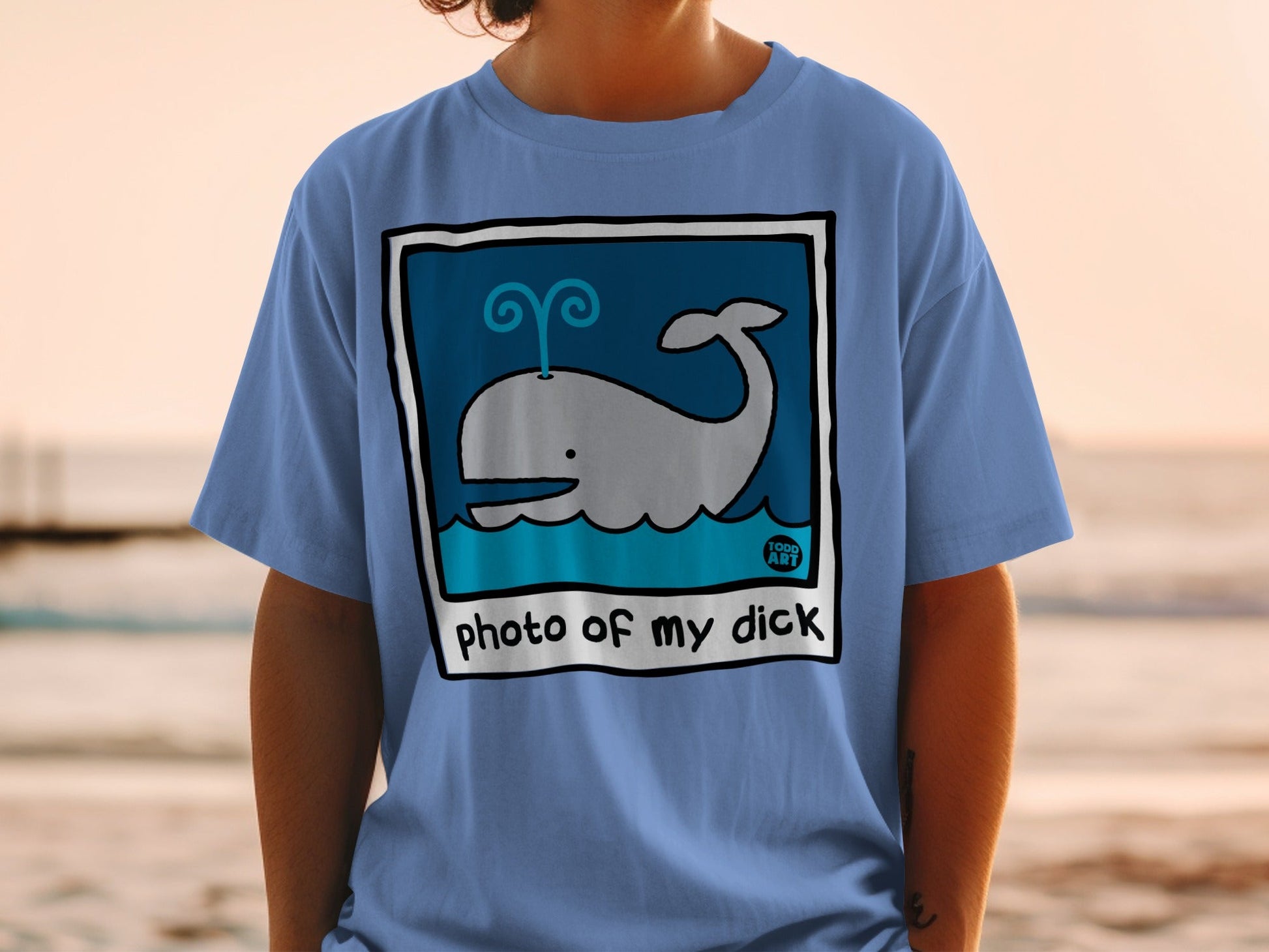 Blue t-shirt with a cartoon whale and text "photo of my dick".