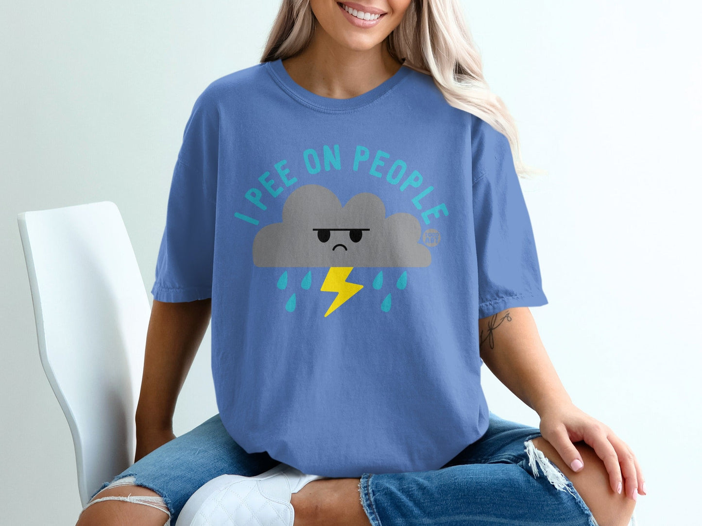 Blue t-shirt with a grumpy cloud graphic and text "I PEE ON PEOPLE".