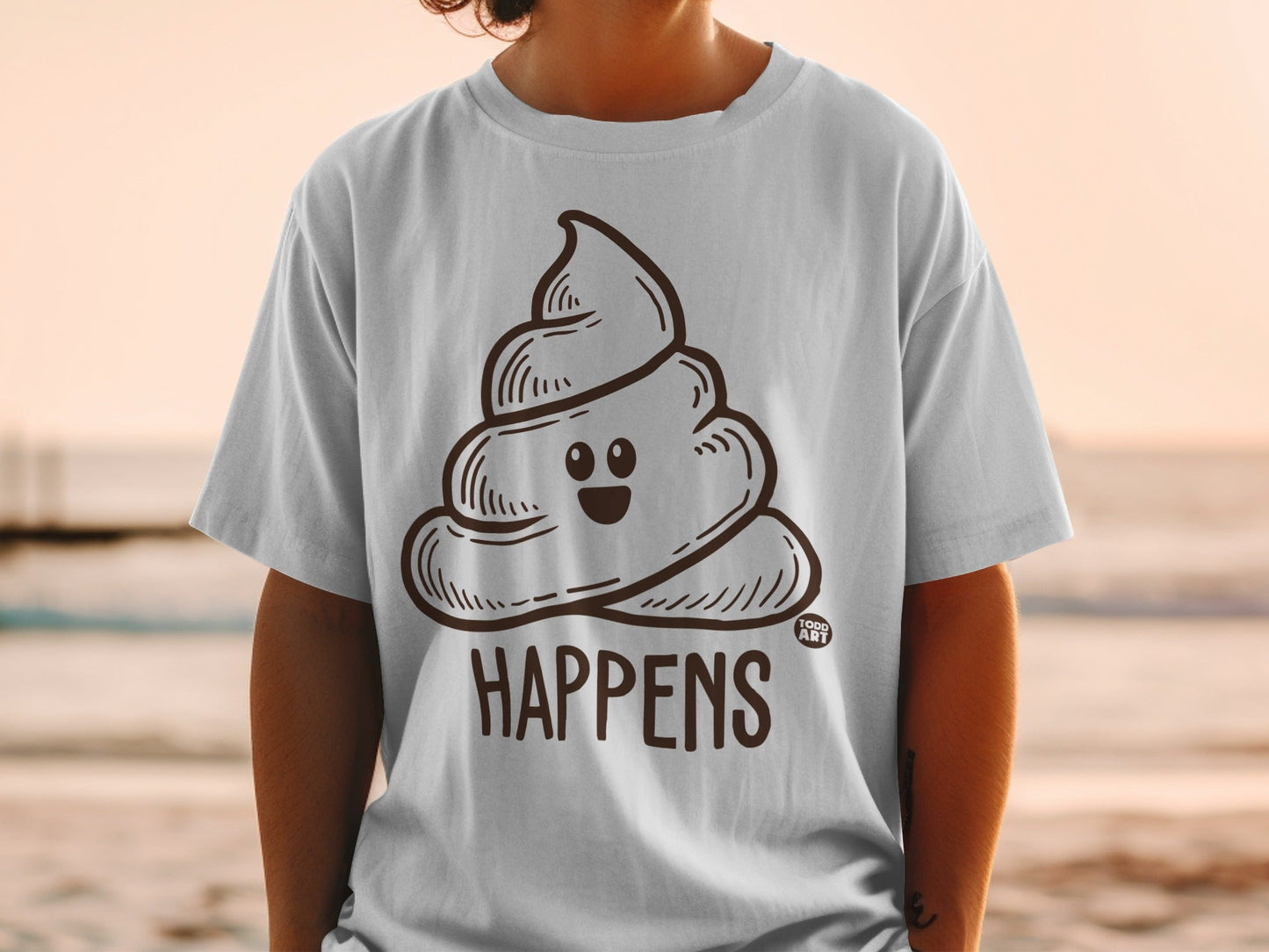 T-shirt with cartoon poop emoji and "Happens" text.