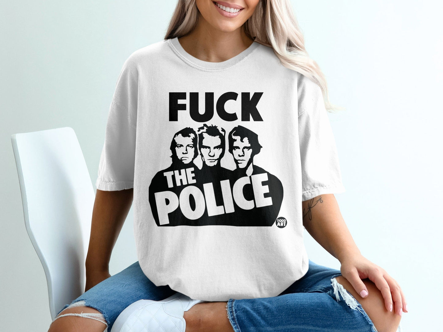 White t-shirt with "FUCK THE POLICE" and band members' portraits.