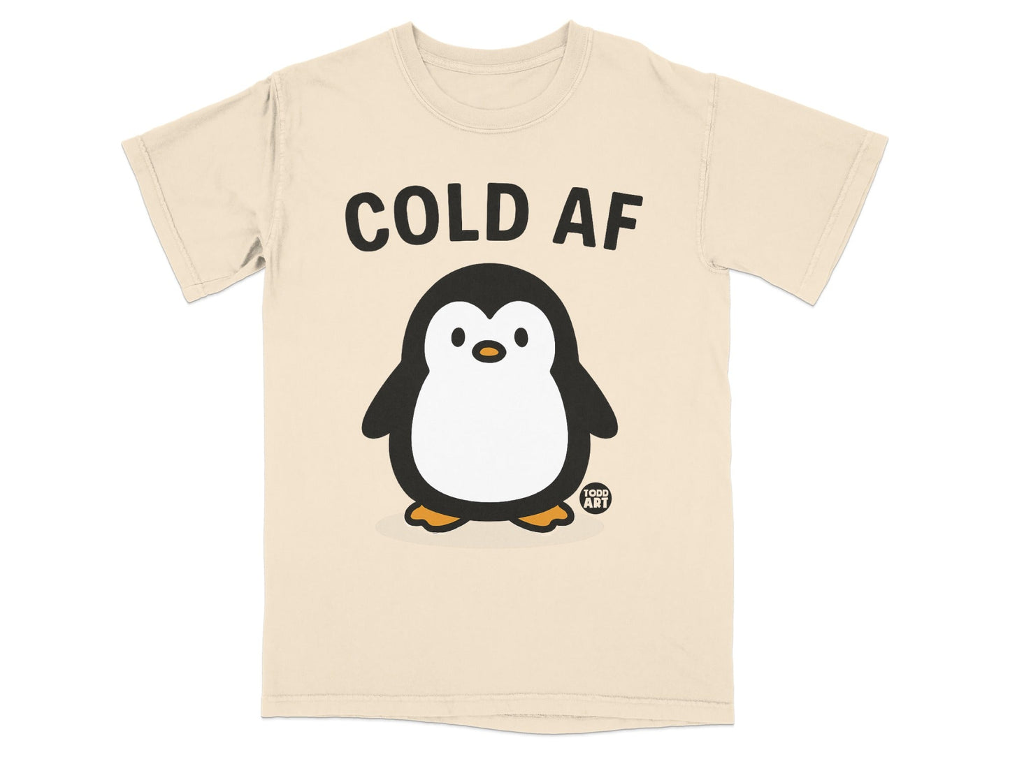 Cream t-shirt with "COLD AF" text above a cartoon penguin illustration.