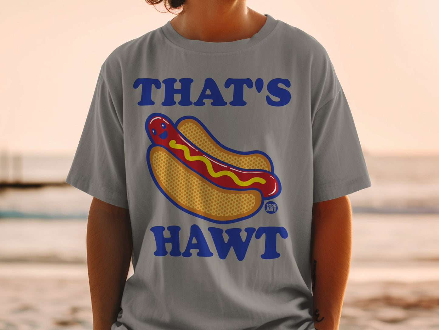 Grey t-shirt with "THAT'S HAWT" and cartoon hot dog graphic.