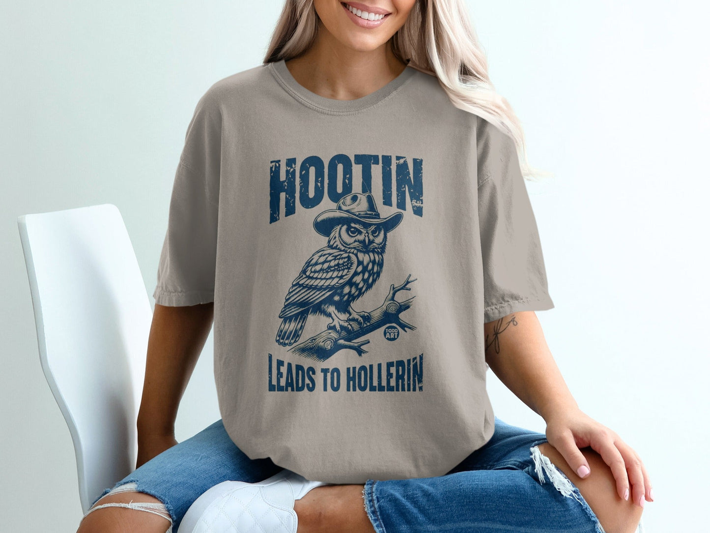 T-shirt with owl wearing cowboy hat and text "HOOTIN LEADS TO HOLLERIN".
