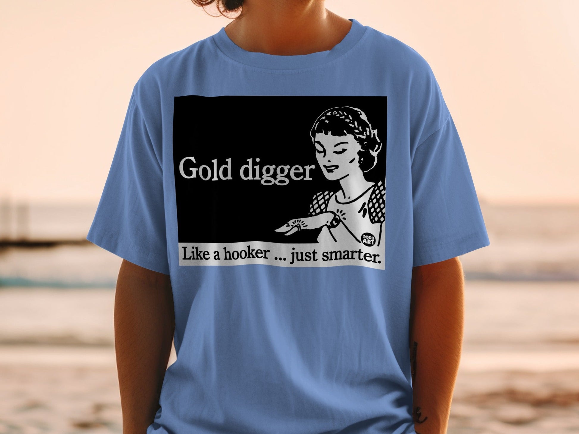T-shirt with black graphic: "Gold digger. Like a hooker... just smarter."