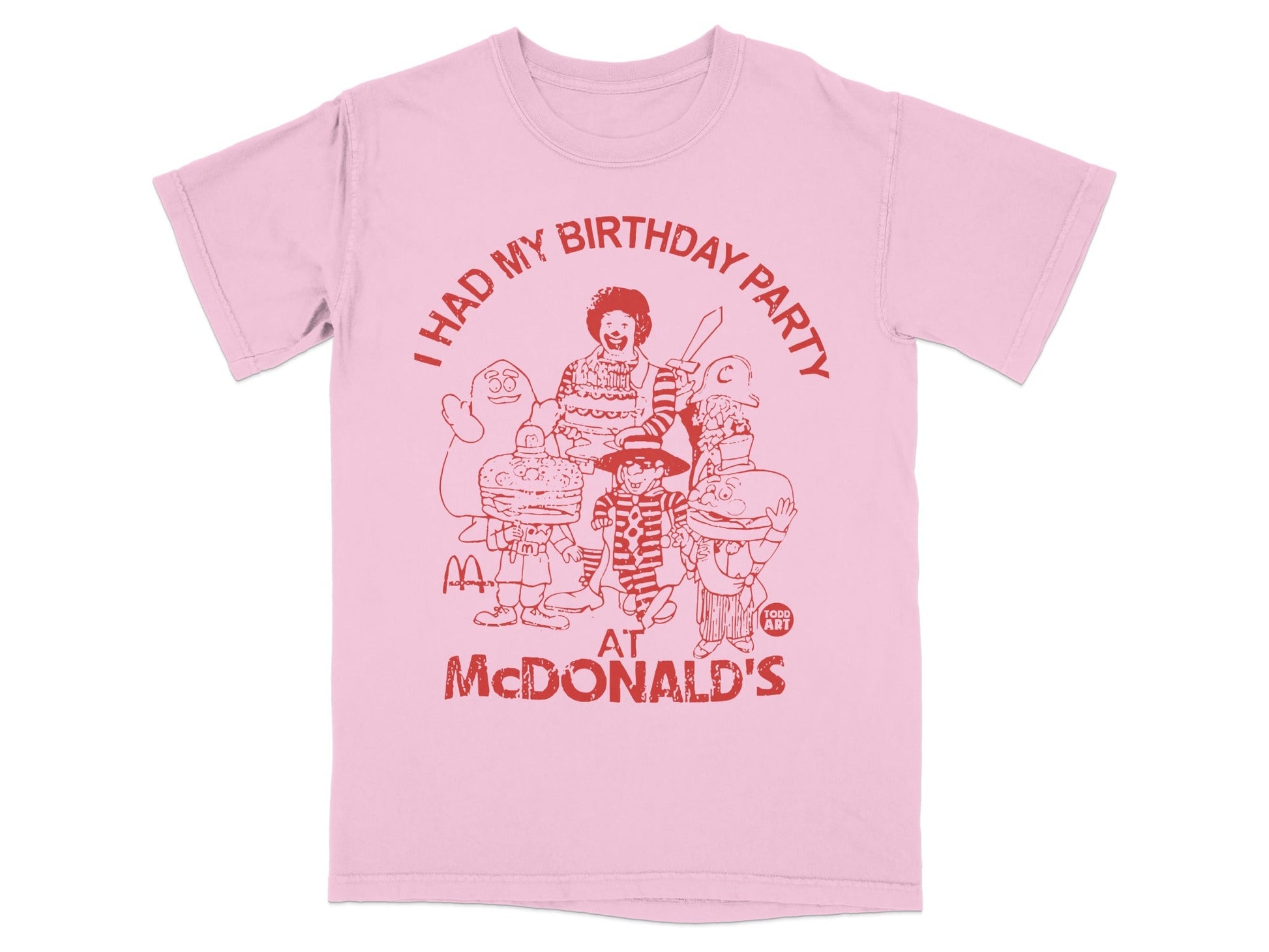 Pink t-shirt with "I HAD MY BIRTHDAY PARTY AT MCDONALD'S" and cartoon characters.