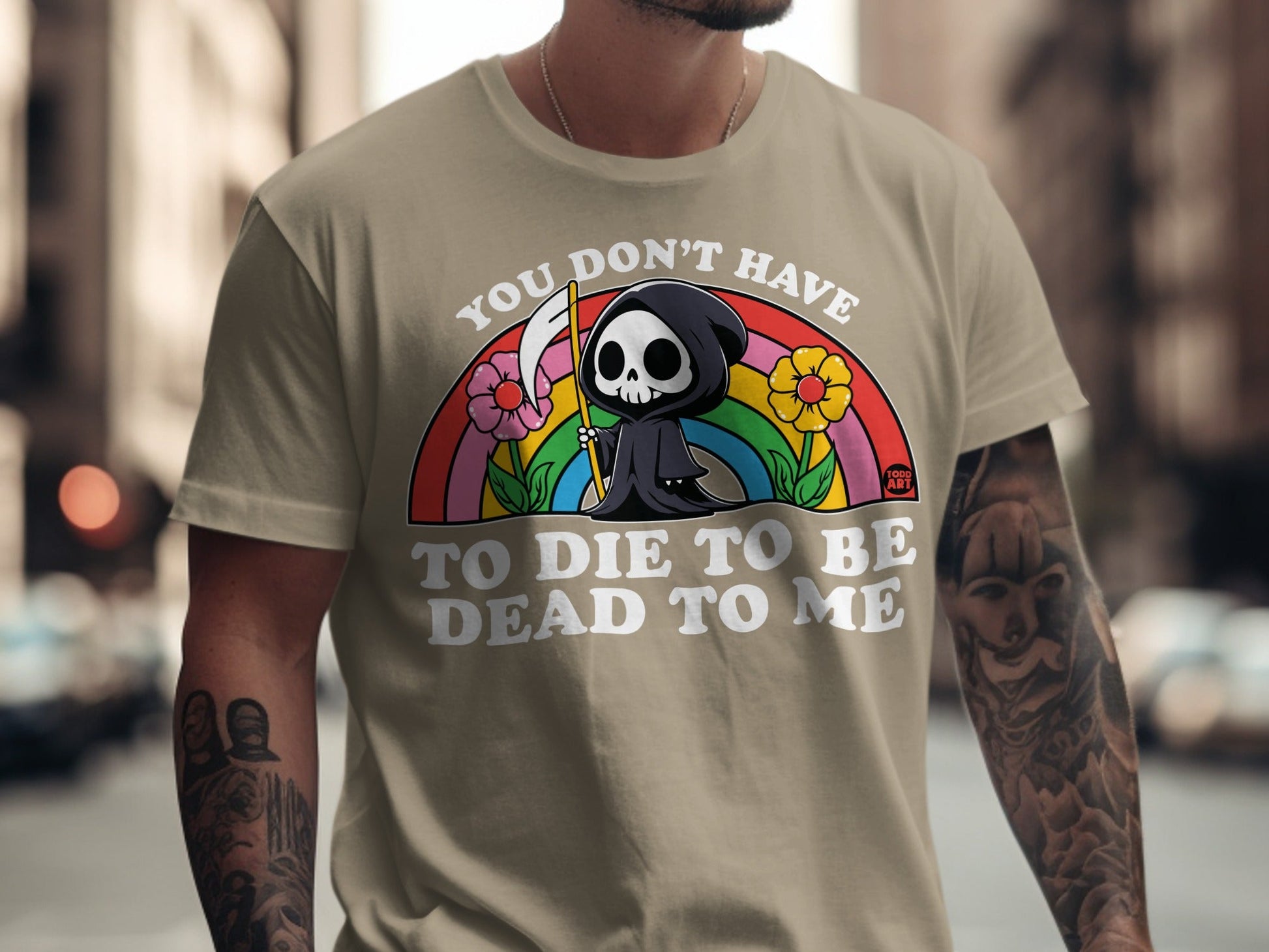 Grim reaper with flowers and rainbow, text reads "You don't have to die to be dead to me."