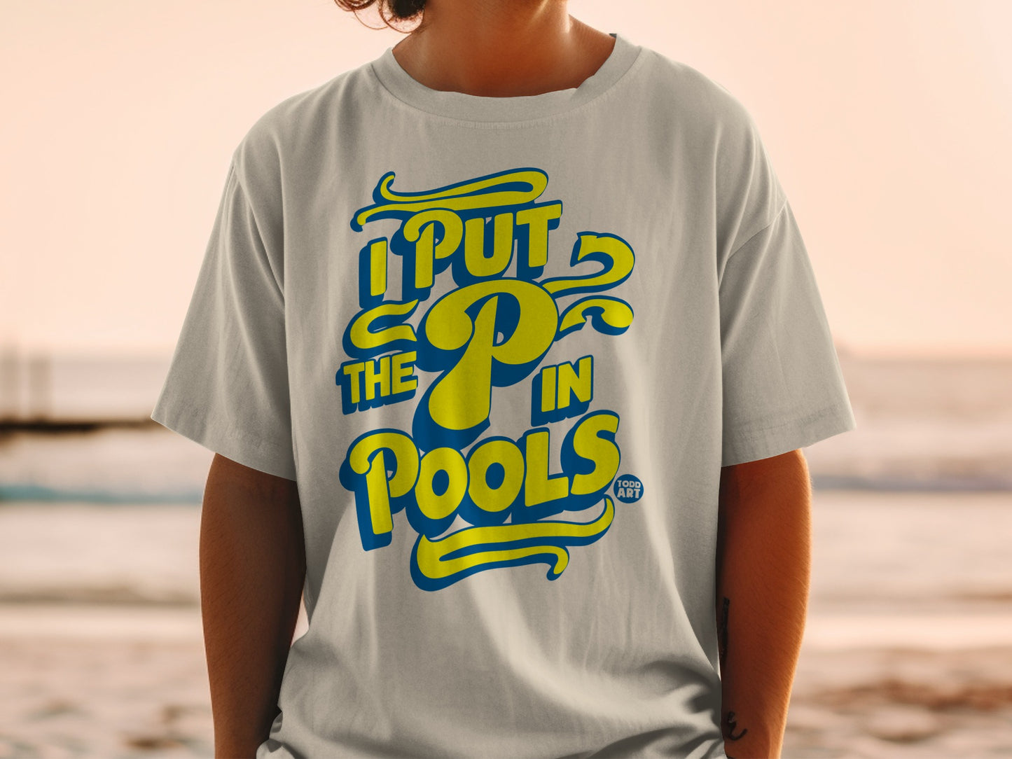 T-shirt with "I Put The P In Pools" text and yellow pool float design.