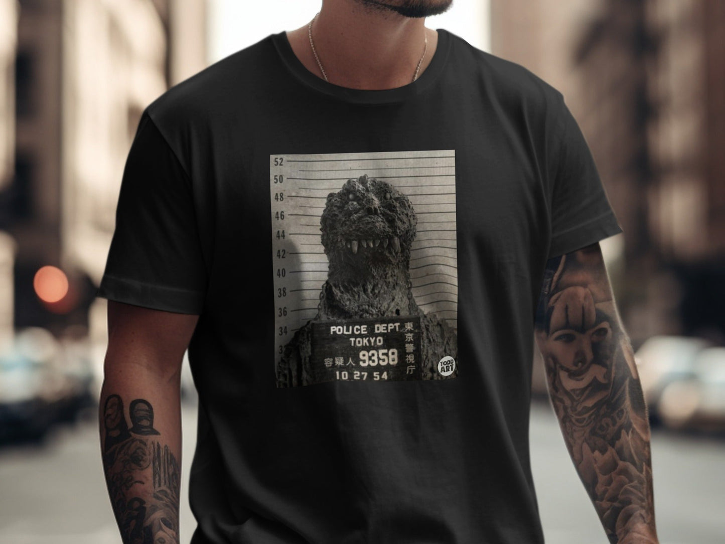 Godzilla mugshot on a black t-shirt, "Tokyo Police Dept." and date.