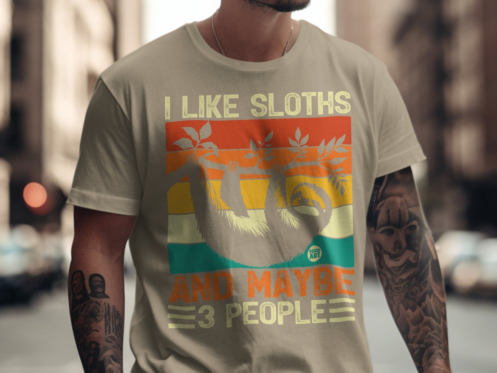 T-shirt with "I Like Sloths and Maybe 3 People" text and sloth graphic.
