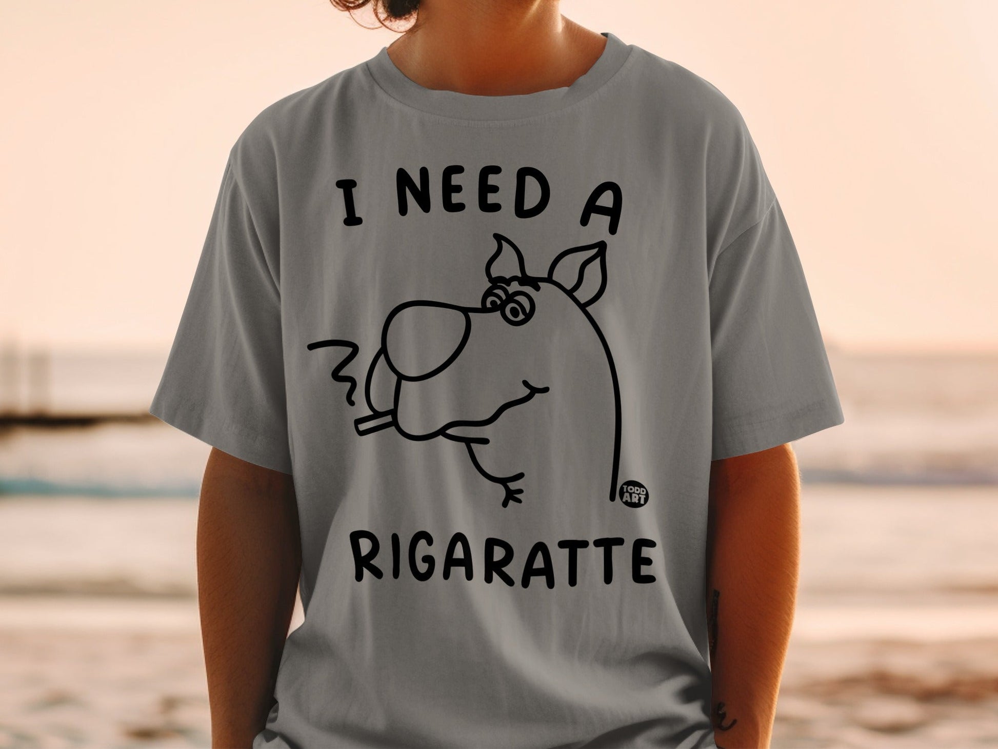 Grey t-shirt with Scooby-Doo smoking, text "I need a rigarette".