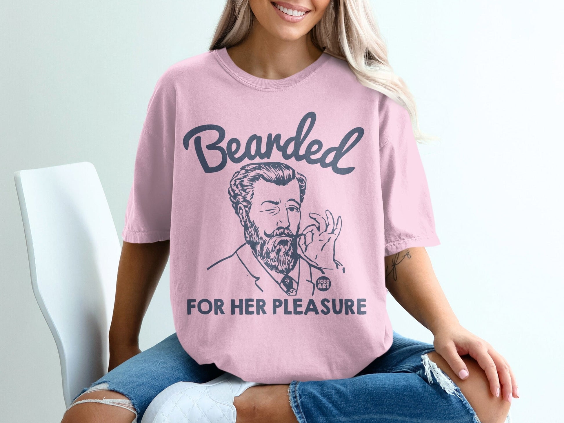 Pink t-shirt with "Bearded for Her Pleasure" graphic featuring a distinguished man.