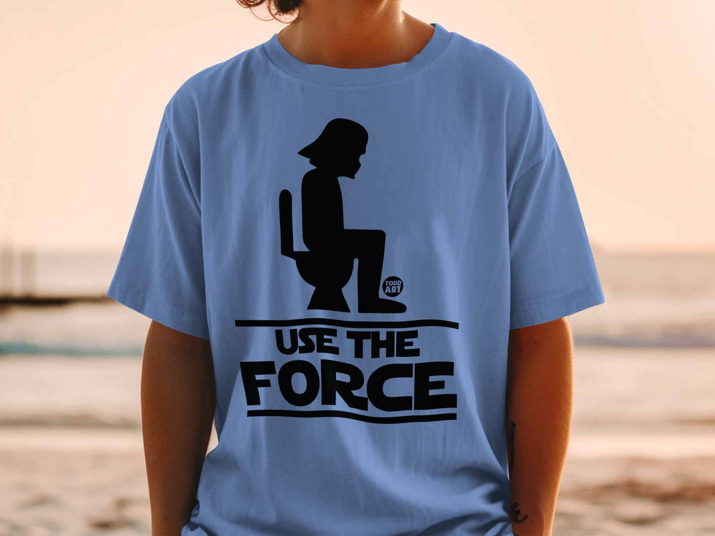 Blue t-shirt with Darth Vader sitting on a toilet and "USE THE FORCE" text.