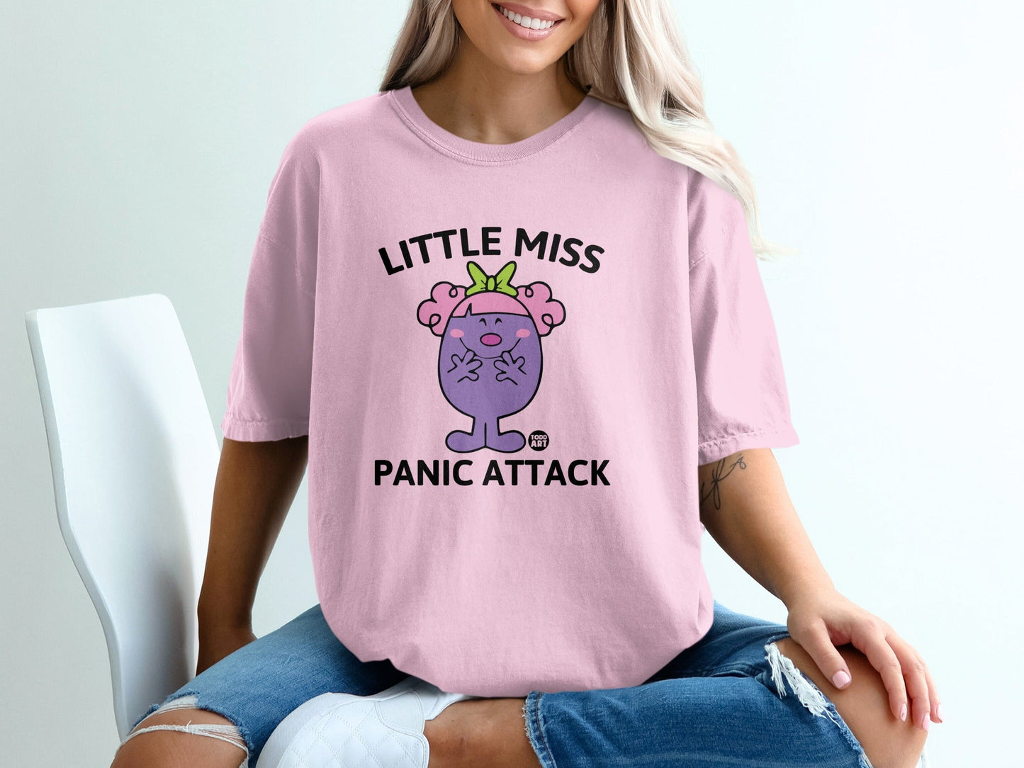 Pink t-shirt with "Little Miss Panic Attack" text and a cartoon character.