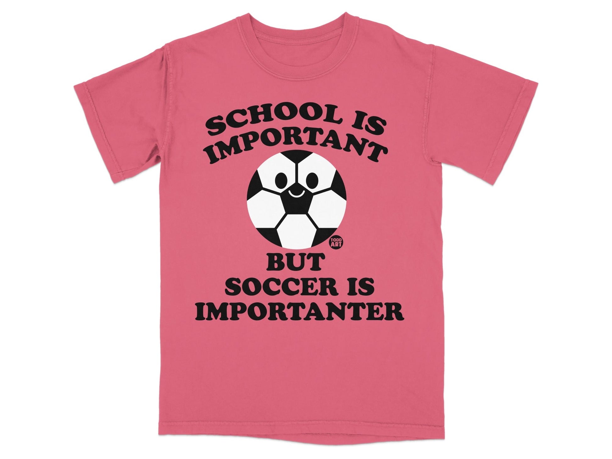 Pink t-shirt with "School is important but soccer is importanter" text and soccer ball graphic.