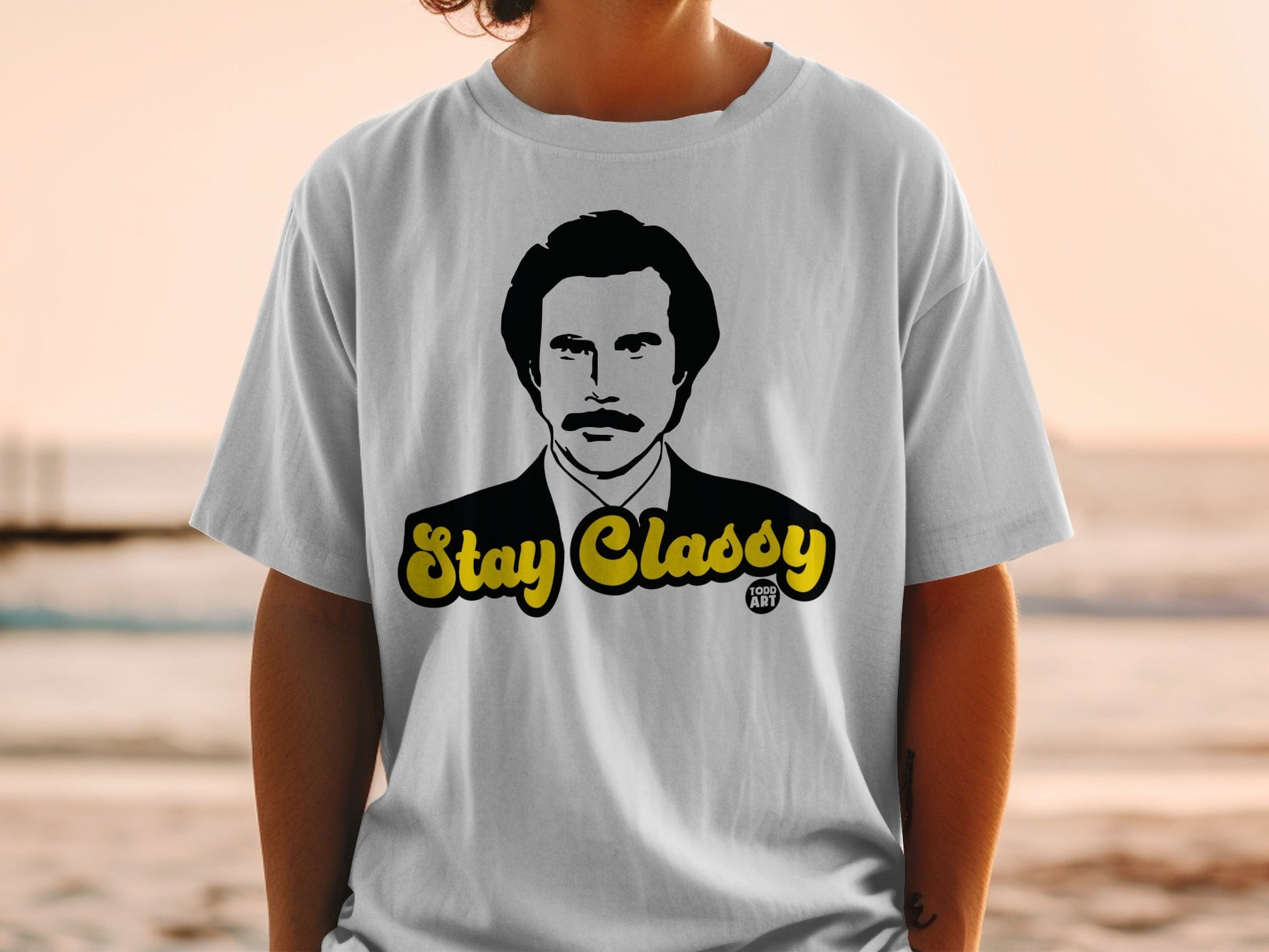 White t-shirt with "Stay Classy" text and Ron Burgundy illustration.