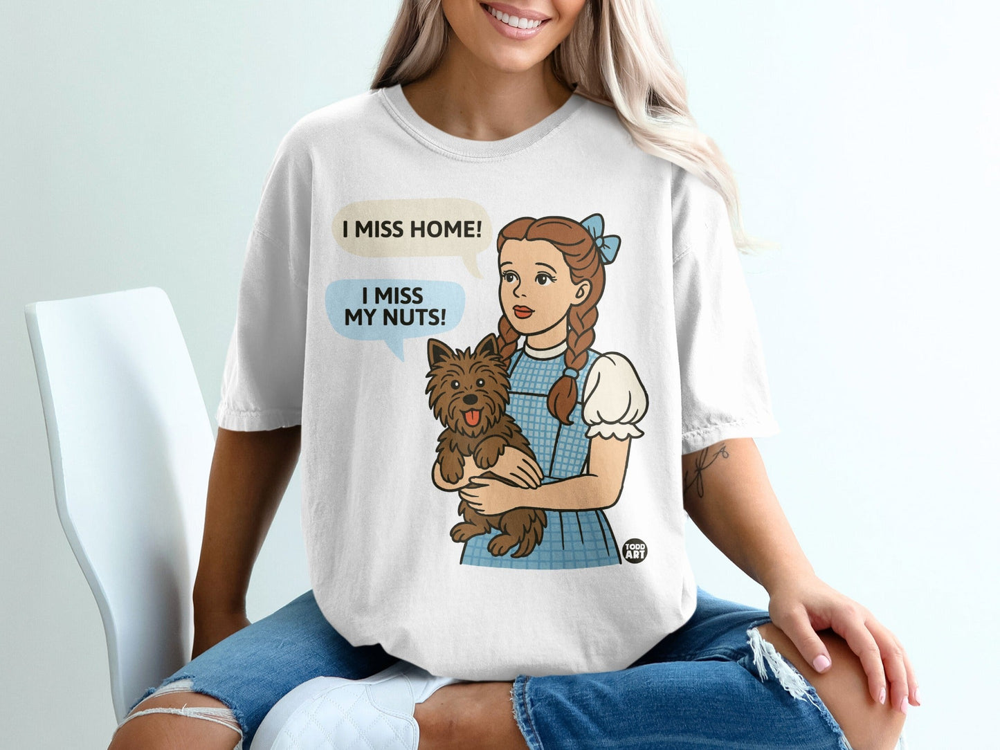 Dorothy from Wizard of Oz holding Toto, "I miss home!" and "I miss my nuts!"