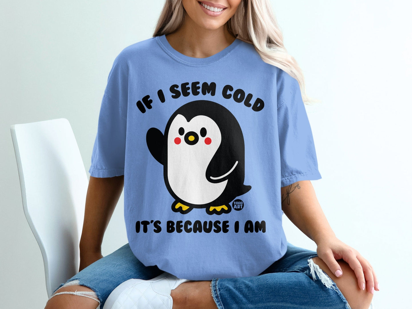 Blue t-shirt with a penguin and "If I seem cold it's because I am" text.
