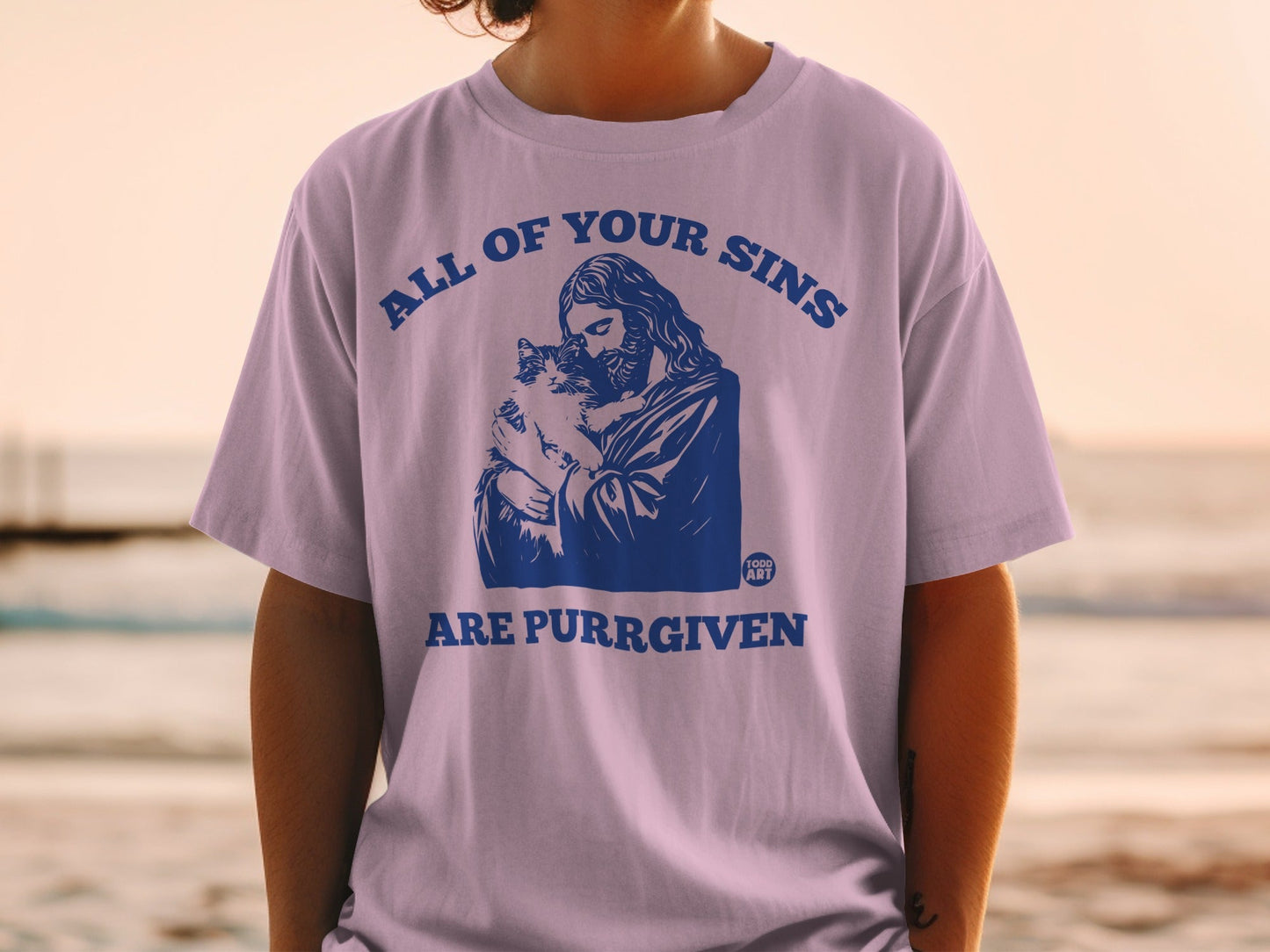 Jesus holding a cat with "All of your sins are purr-given" text.