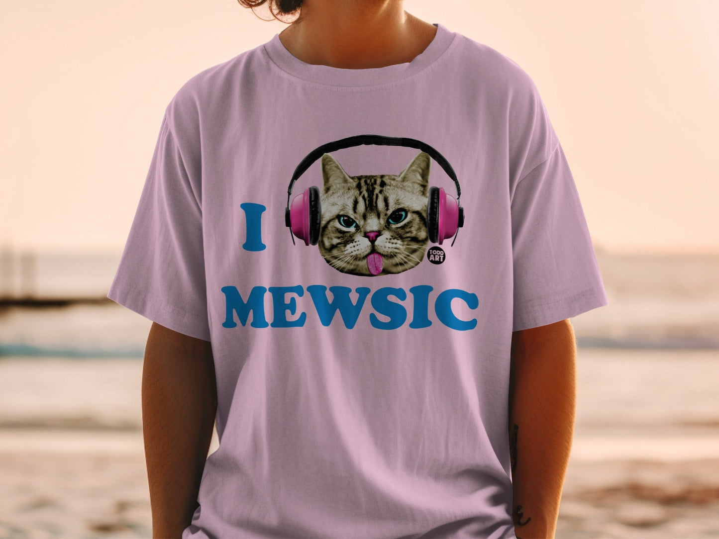 Pink t-shirt with cat wearing headphones and "I MEWSIC" text.