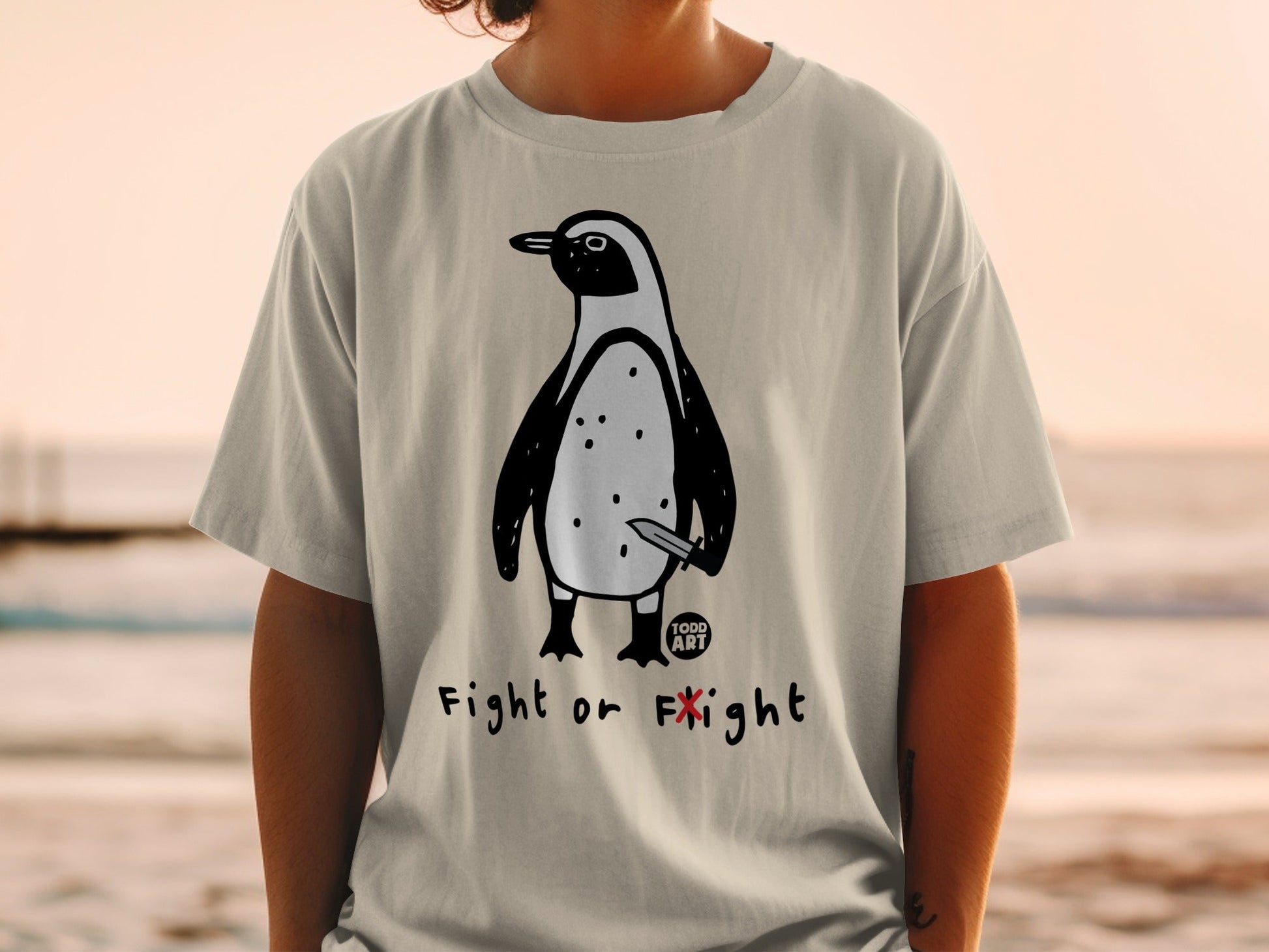 Penguin with knife graphic on t-shirt, "Fight or Flight" text.