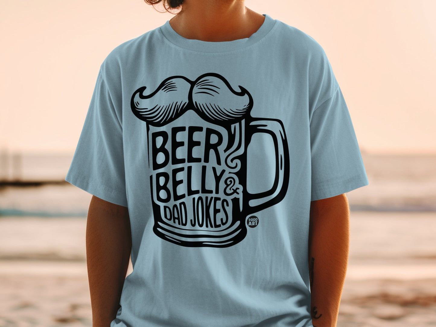 Light blue t-shirt with "Beer Belly & Dad Jokes" graphic and mustache.