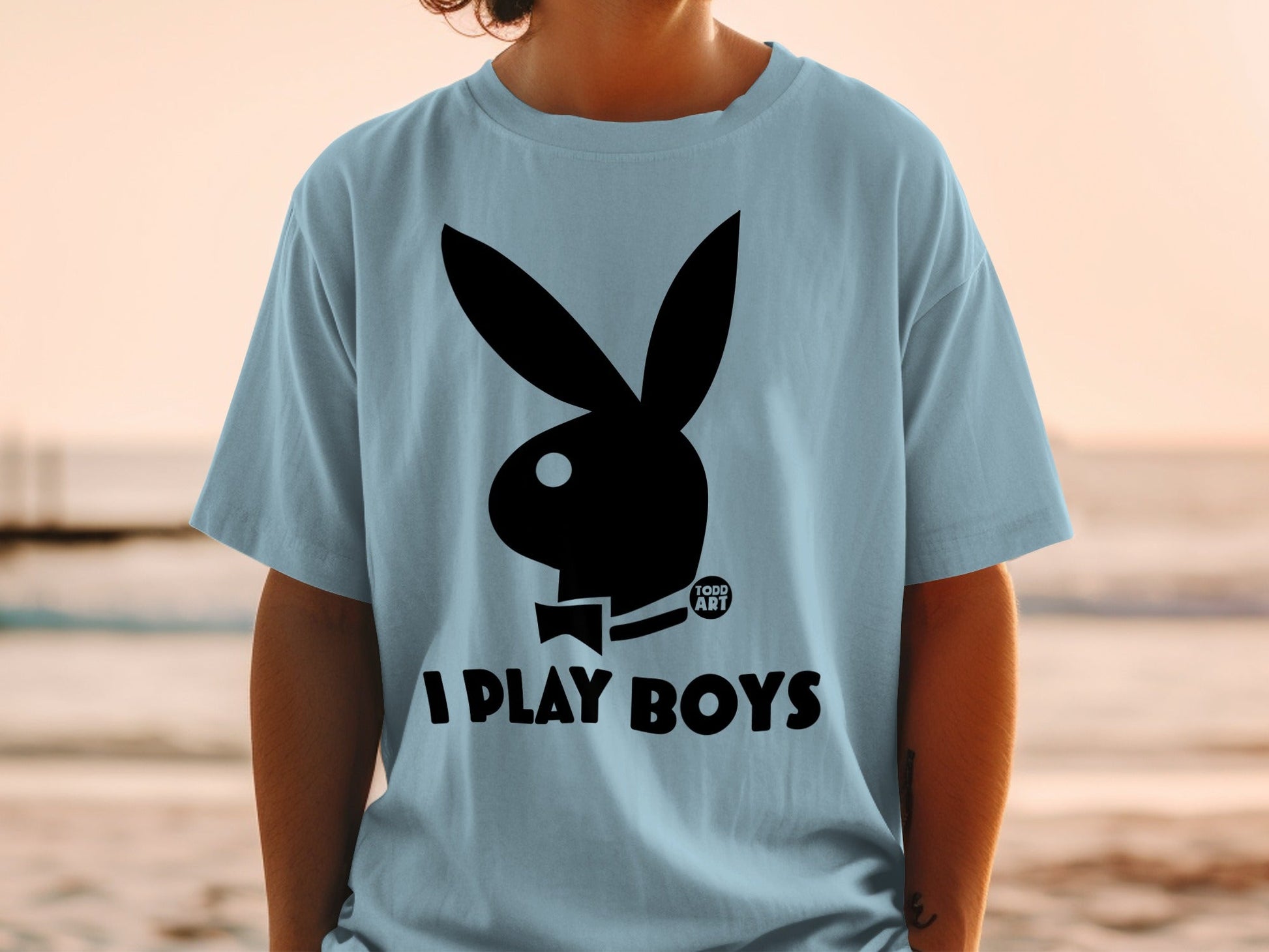 Light blue t-shirt with black Playboy bunny logo and "I PLAY BOYS" text.