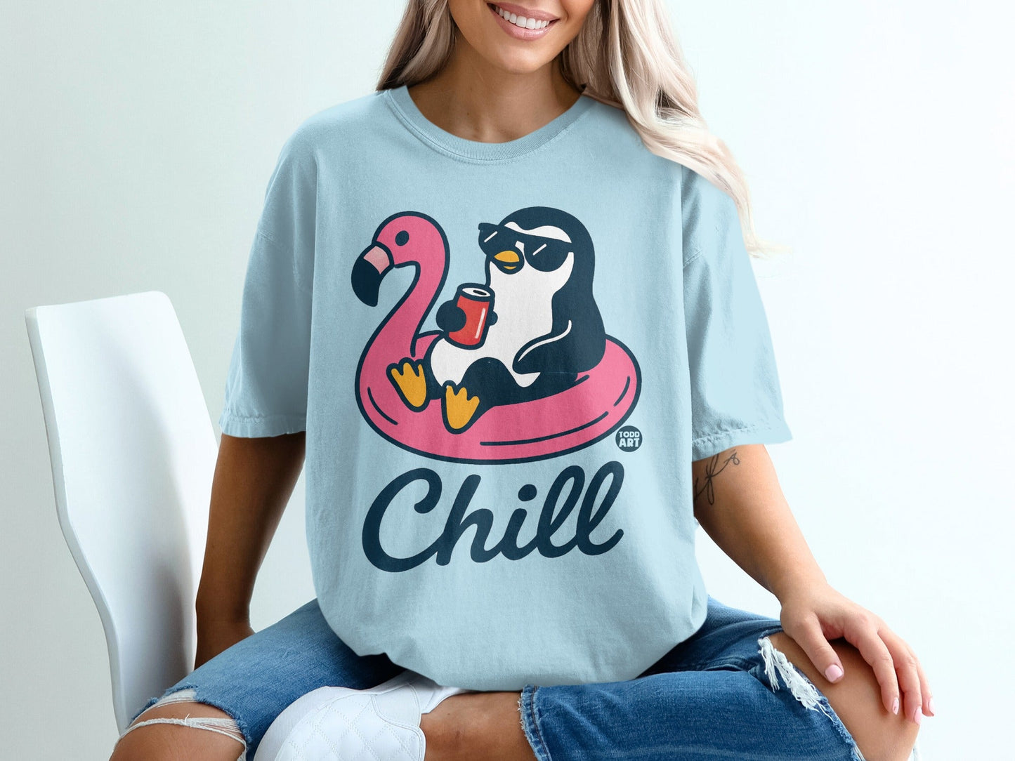 Cartoon penguin in sunglasses floats on pink flamingo pool float, holding a drink.