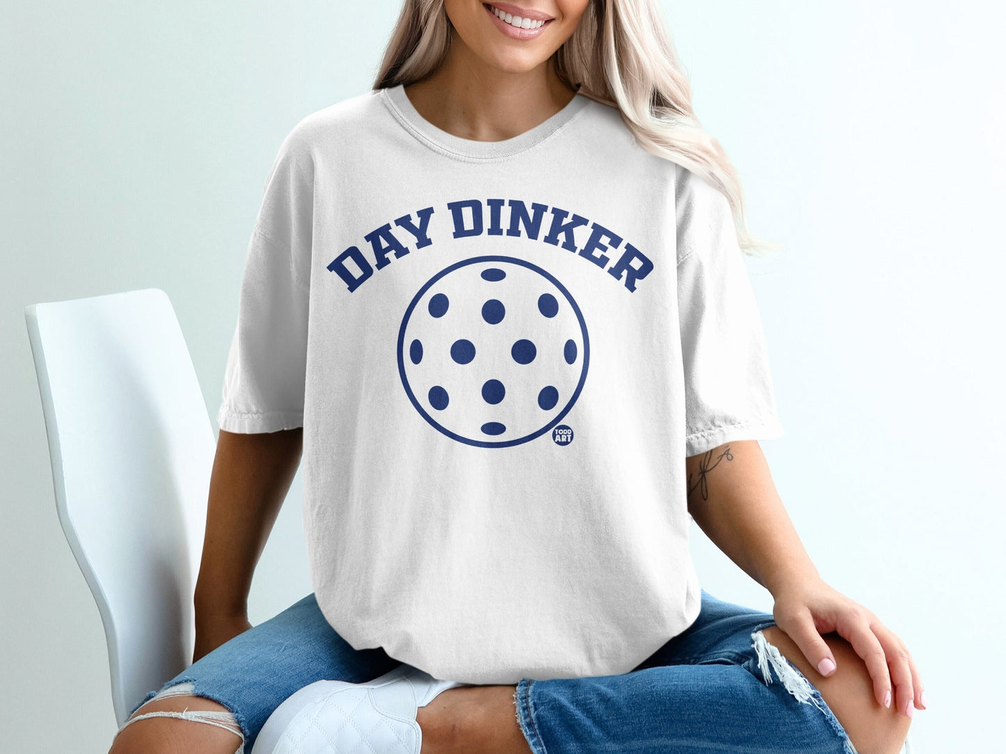 White t-shirt with "DAY DINKER" and pickleball graphic.