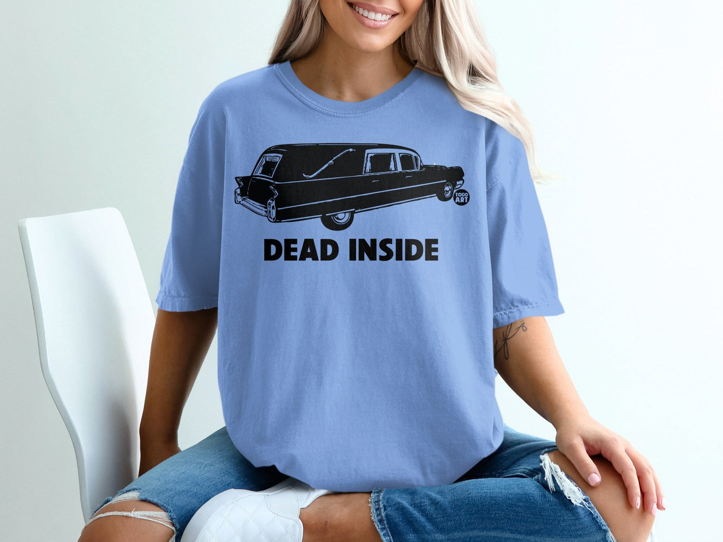 Blue t-shirt with a hearse graphic and "DEAD INSIDE" text.