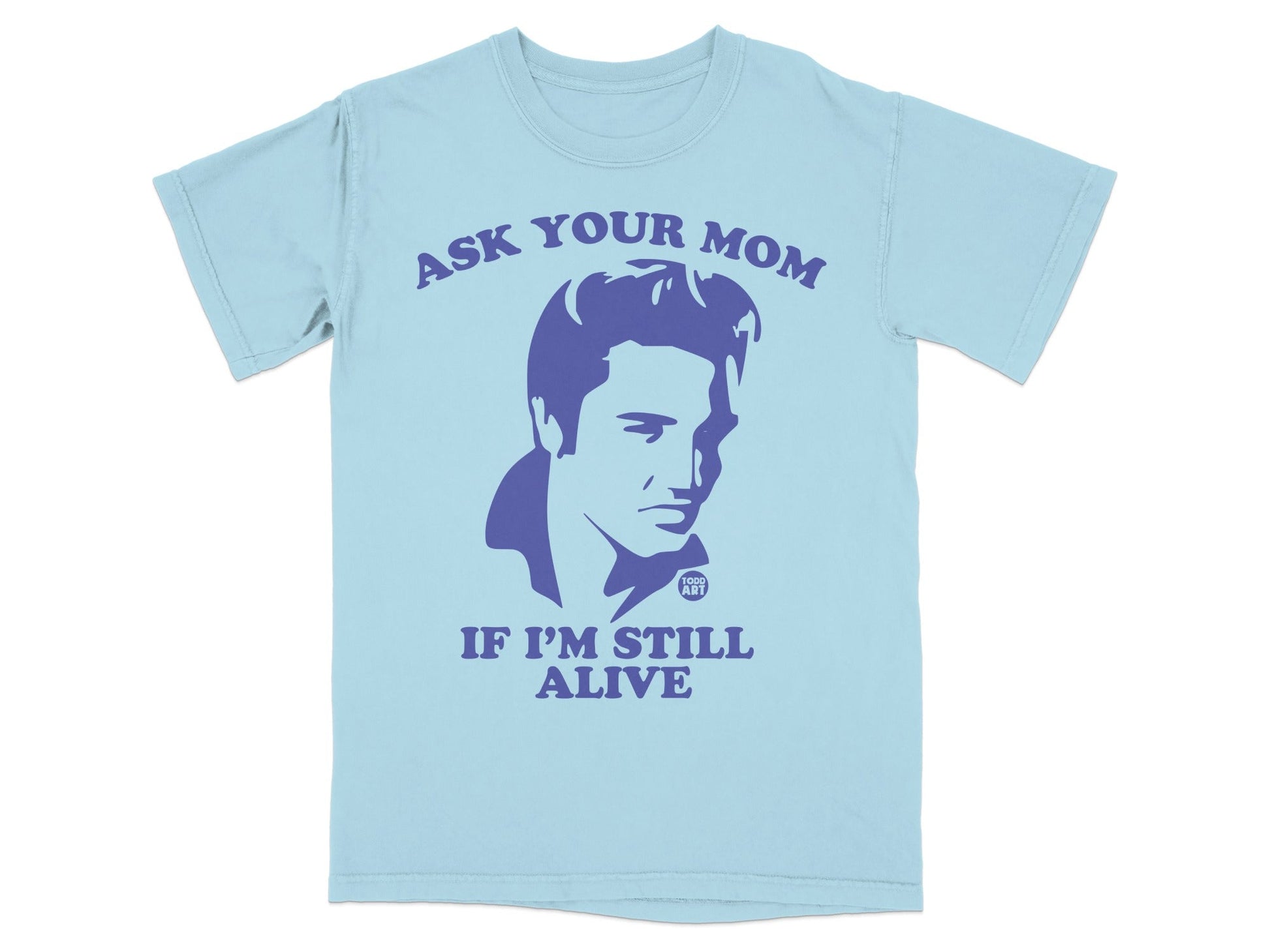 Light blue t-shirt with purple graphic of Elvis Presley and text "Ask Your Mom If I'm Still Alive".