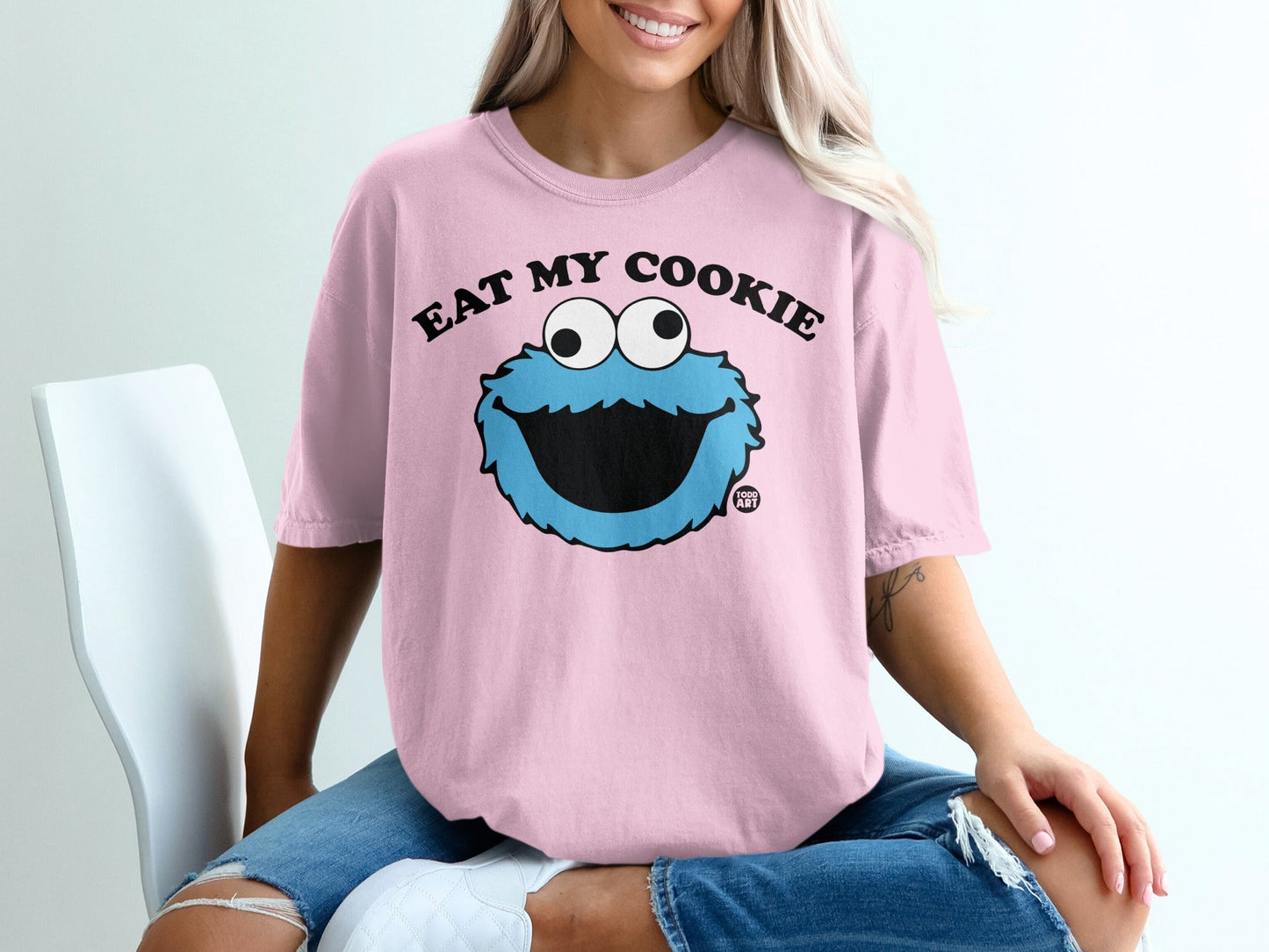 Pink t-shirt with Cookie Monster saying "Eat My Cookie"