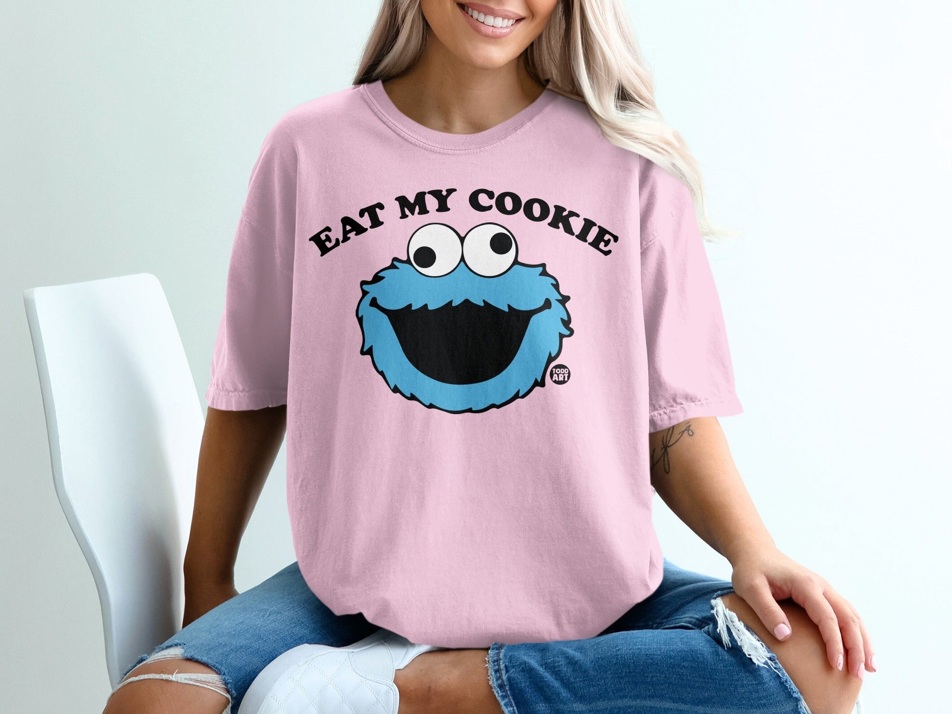 Pink t-shirt with Cookie Monster saying "Eat My Cookie"
