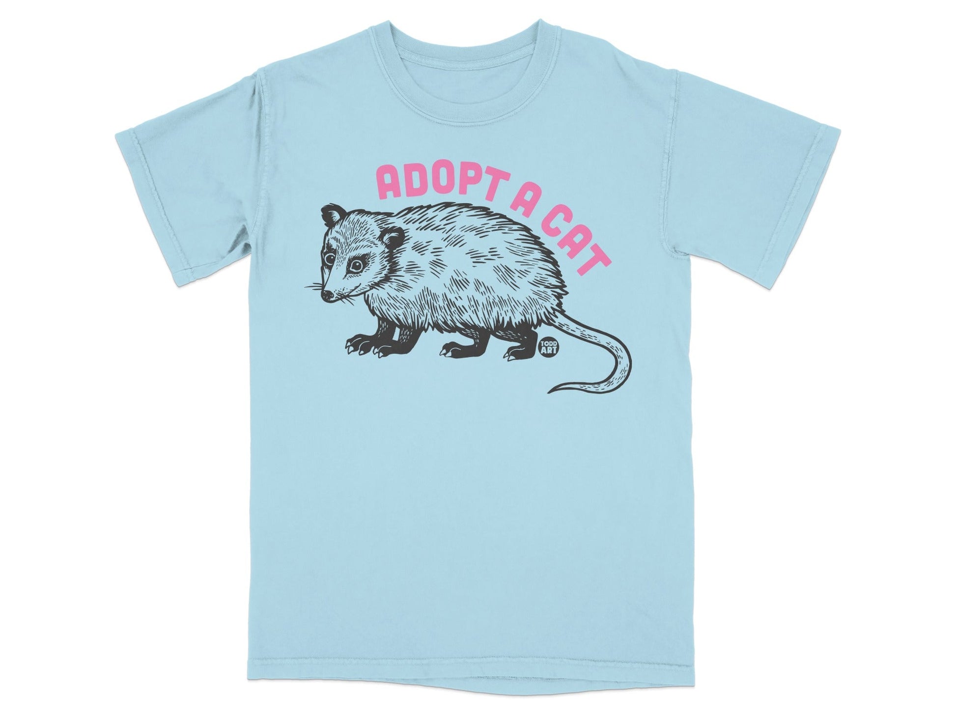 Light blue t-shirt with black opossum graphic and pink text "ADOPT A CAT".