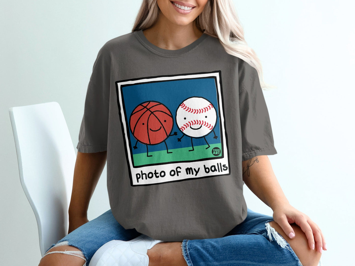 Basketball and baseball characters holding hands with "photo of my balls" text.
