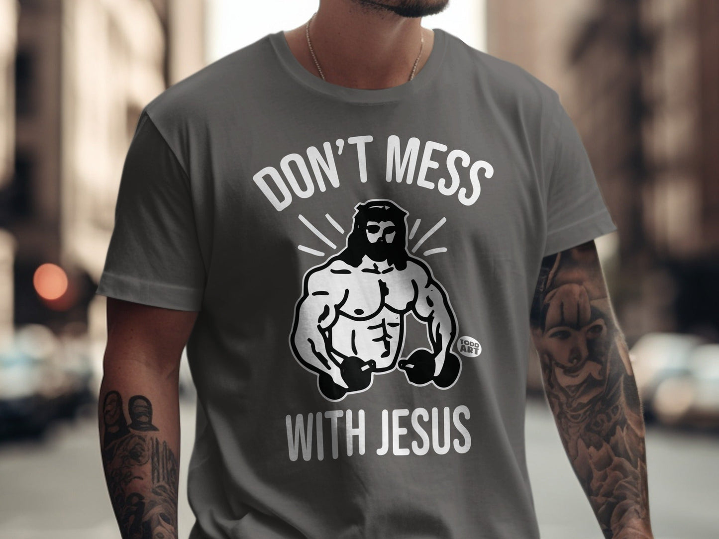 Gray t-shirt with muscular Jesus graphic and "Don't Mess With Jesus" text.