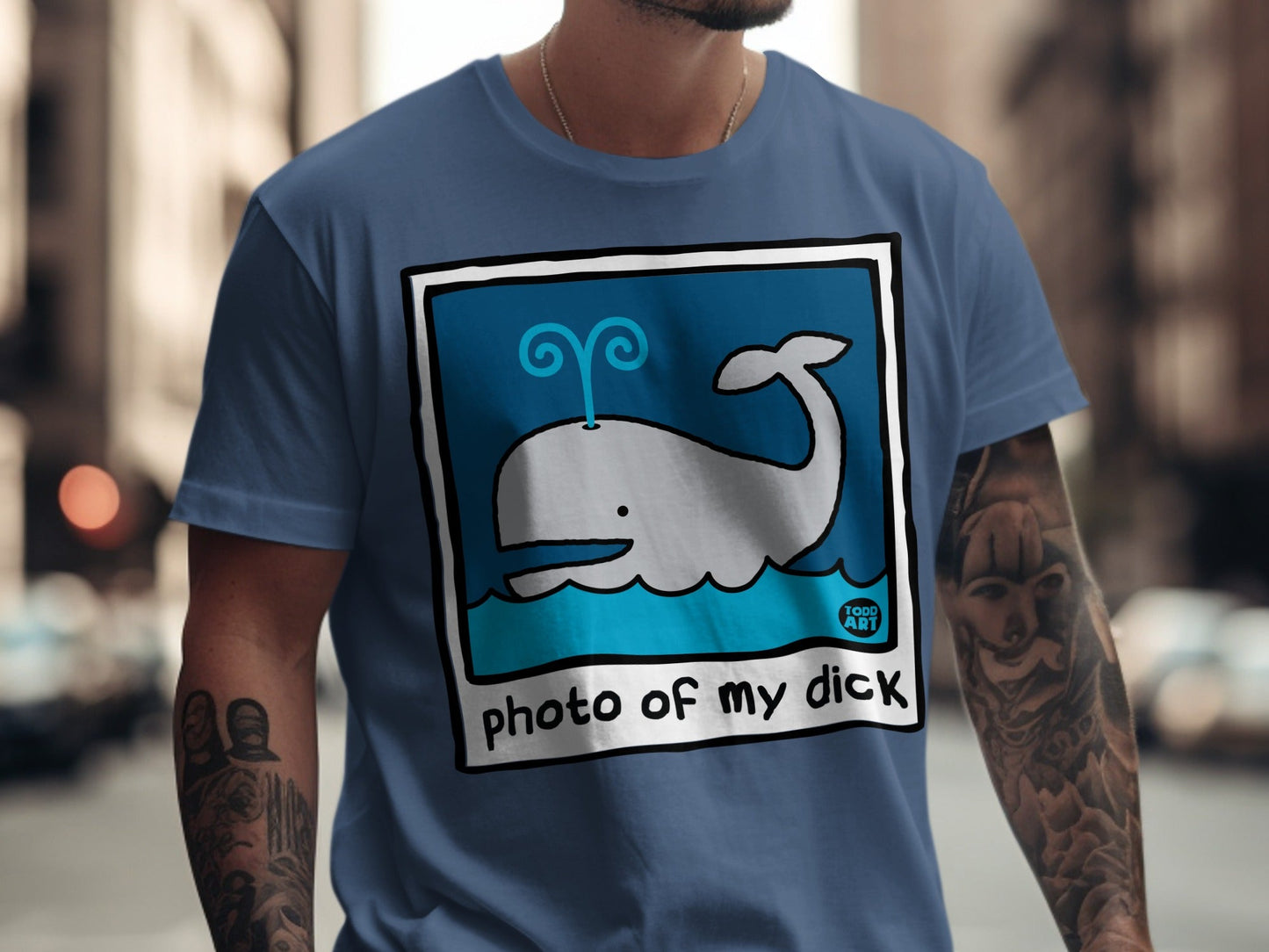 Blue t-shirt with cartoon whale graphic and "photo of my dick" text.