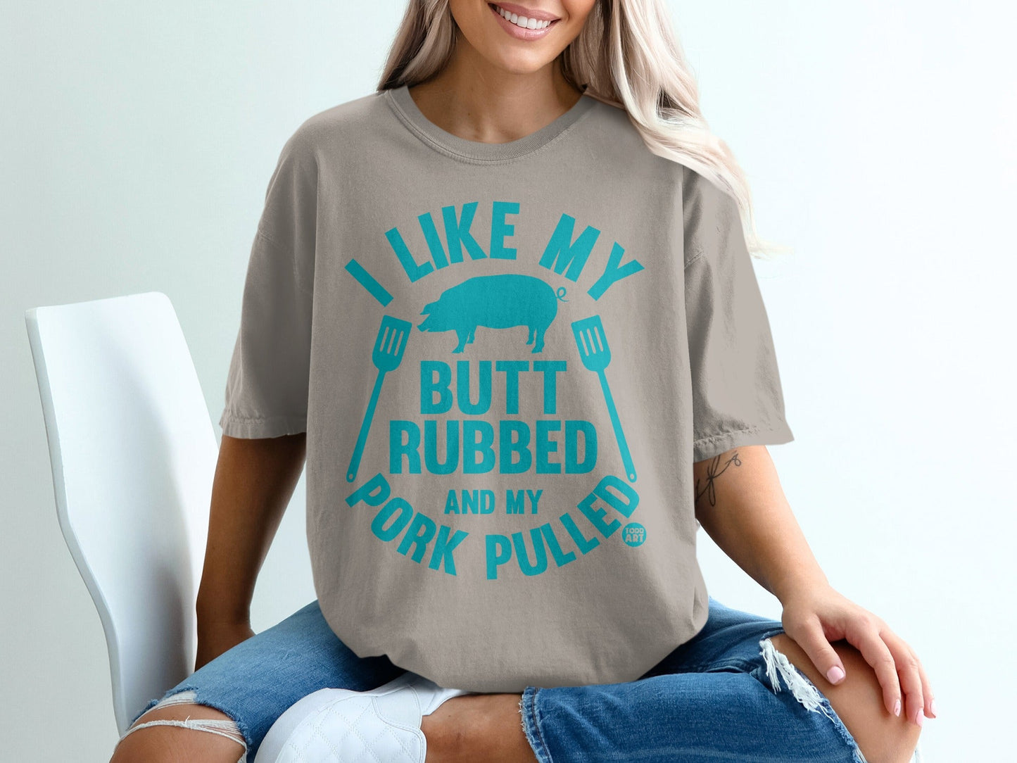 Gray t-shirt with blue text "I LIKE MY BUTT RUBBED AND MY PORK PULLED" and pig graphic.