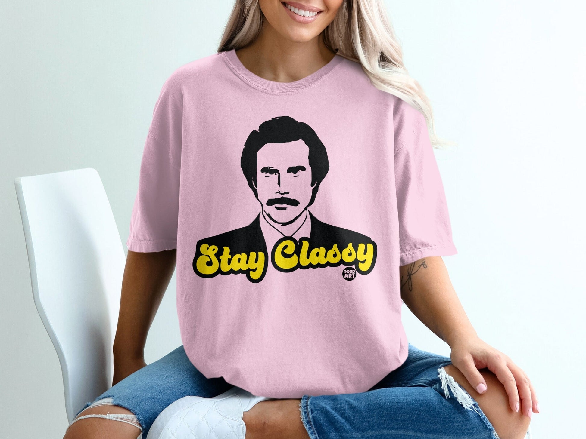 Pink t-shirt with "Stay Classy" text and Will Ferrell's Ron Burgundy graphic.