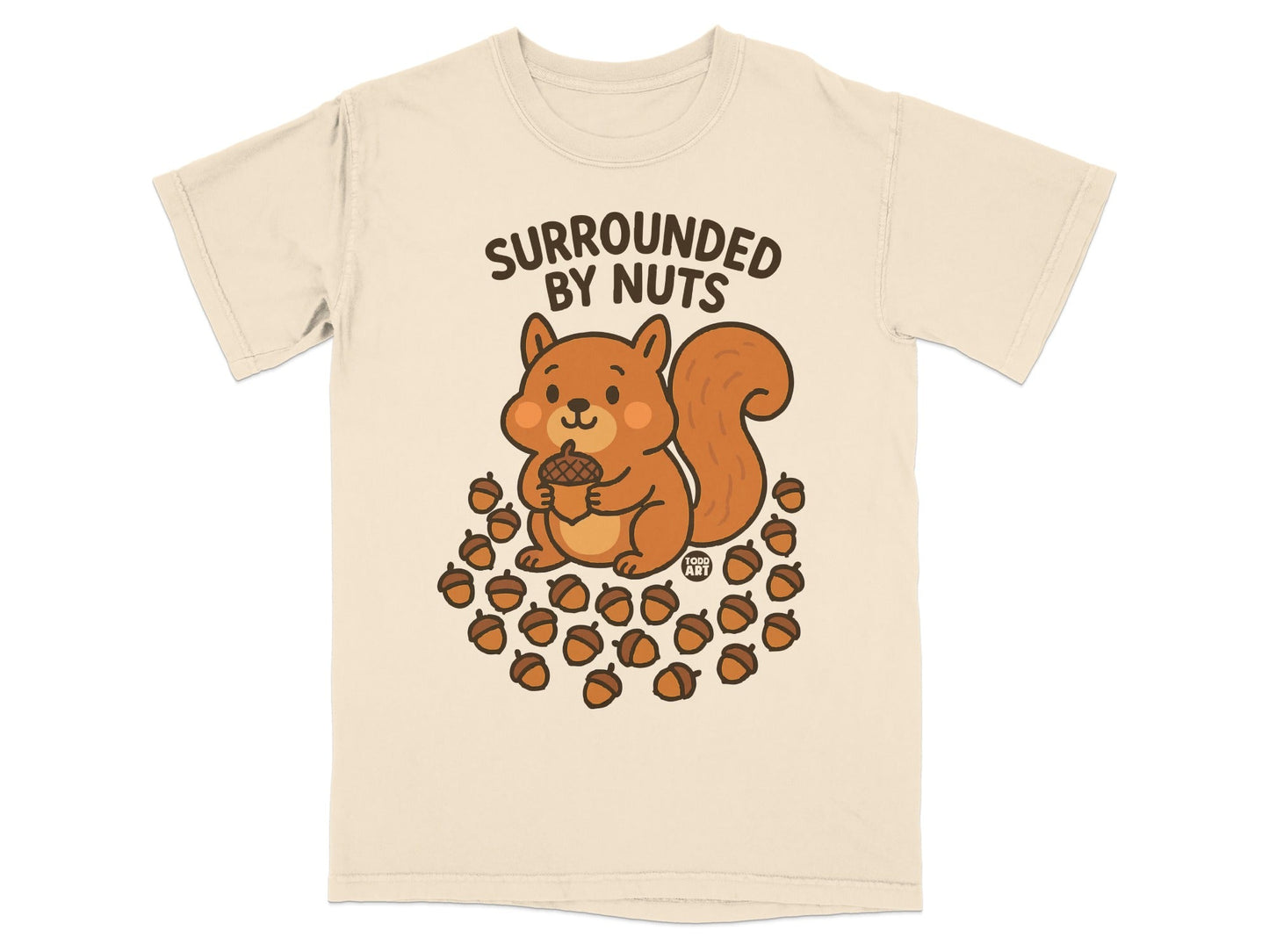 Cute cartoon squirrel holding acorn surrounded by nuts on a cream t-shirt.