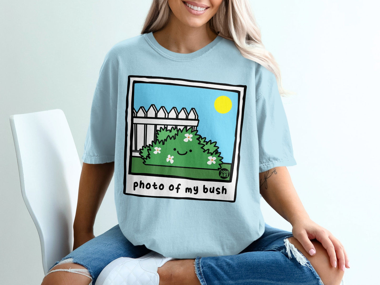 Cartoon bush with smiley faces, "photo of my bush" text.