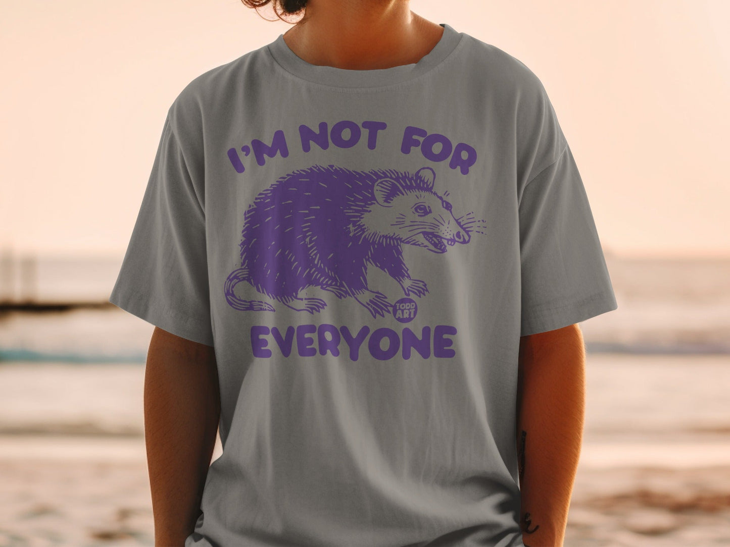Gray t-shirt with purple possum graphic and "I'M NOT FOR EVERYONE" text.
