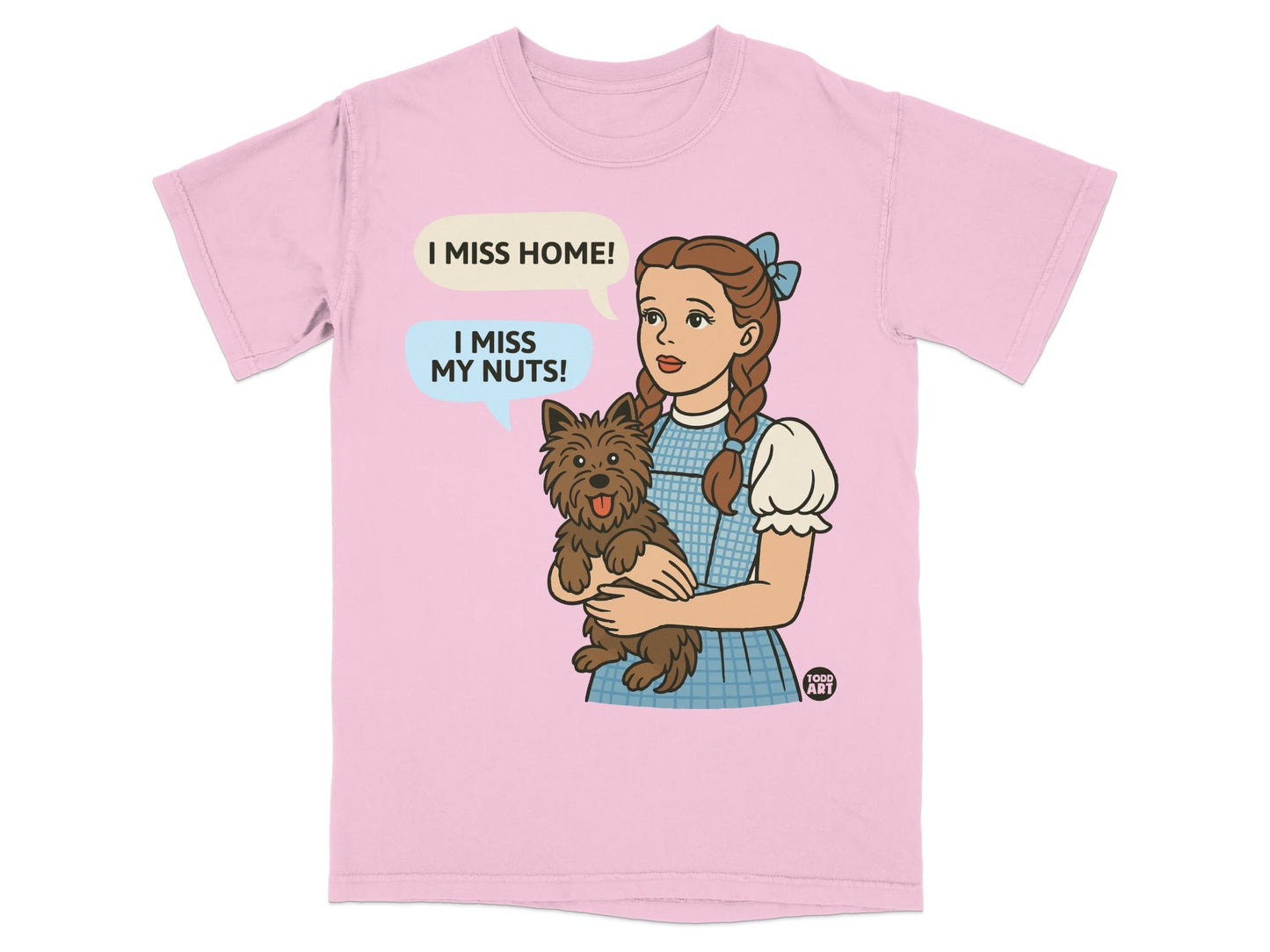 Dorothy holding Toto, with speech bubbles saying "I miss home!" and "I miss my nuts!".