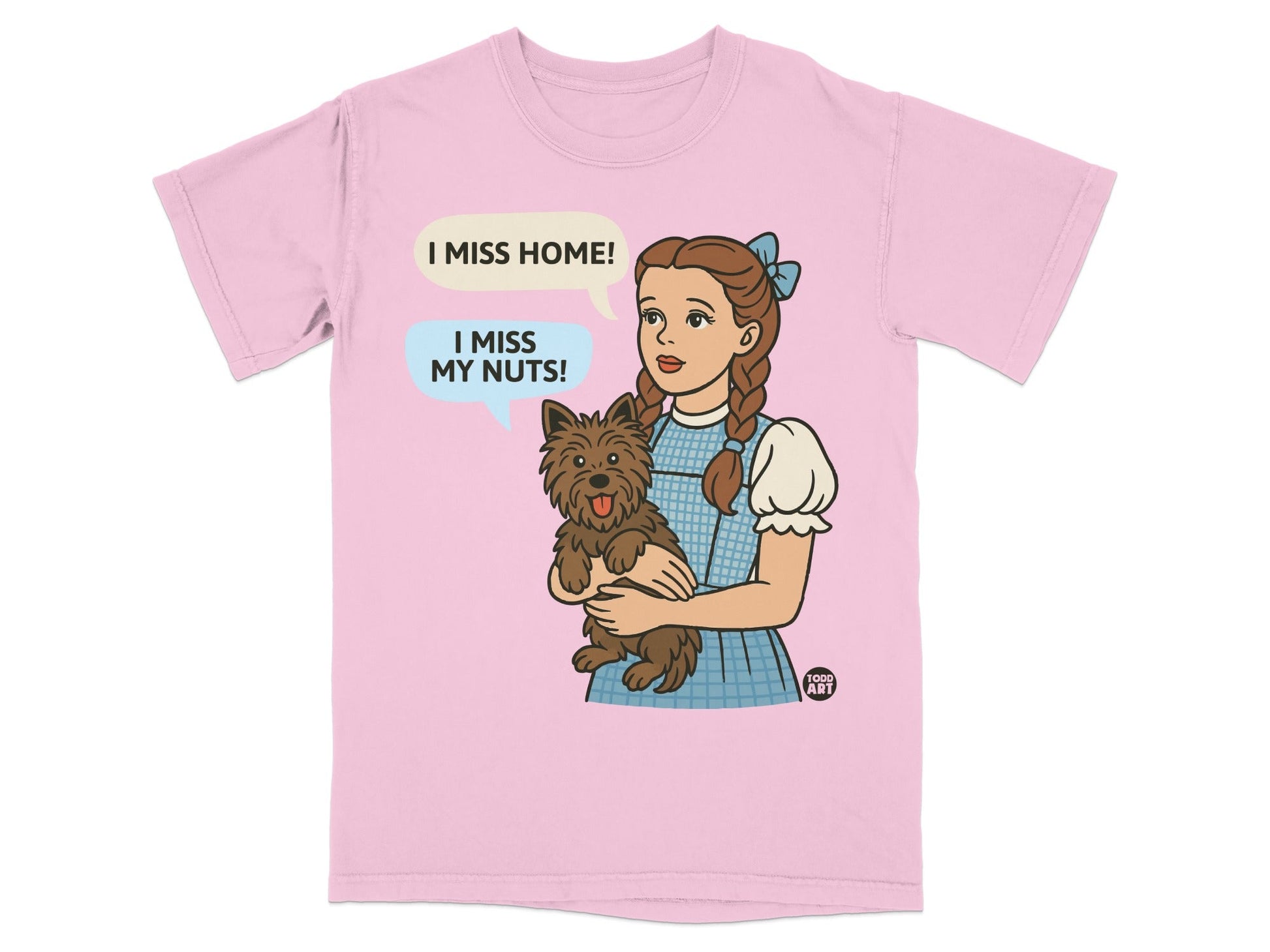 Dorothy holding Toto, with speech bubbles saying "I miss home!" and "I miss my nuts!".