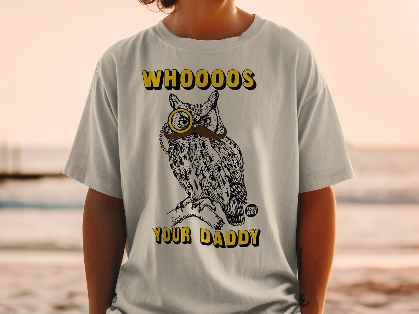 T-shirt with a drawing of an owl wearing a monocle and mustache, saying "WHOOO'S YOUR DADDY".