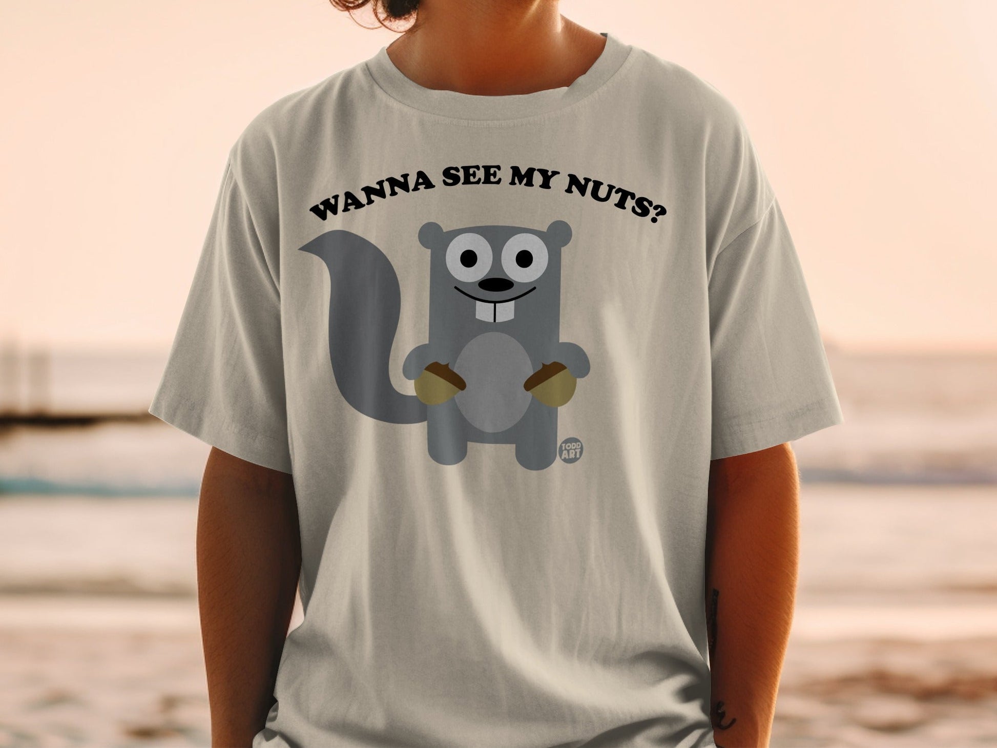 Cartoon squirrel wearing a t-shirt that says "Wanna see my nuts?".
