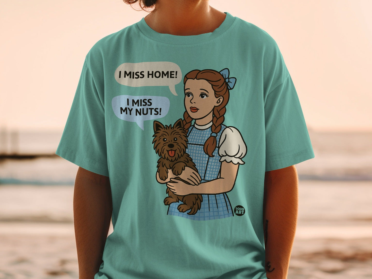 Dorothy from Wizard of Oz holding Toto, with speech bubbles saying "I MISS HOME!"