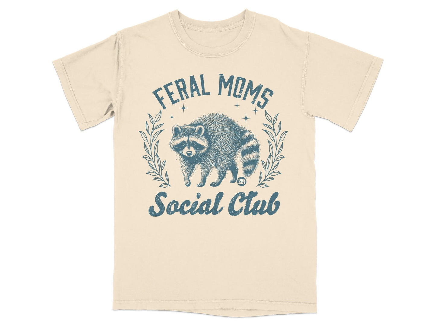 Cream t-shirt with raccoon graphic and "Feral Moms Social Club" text.