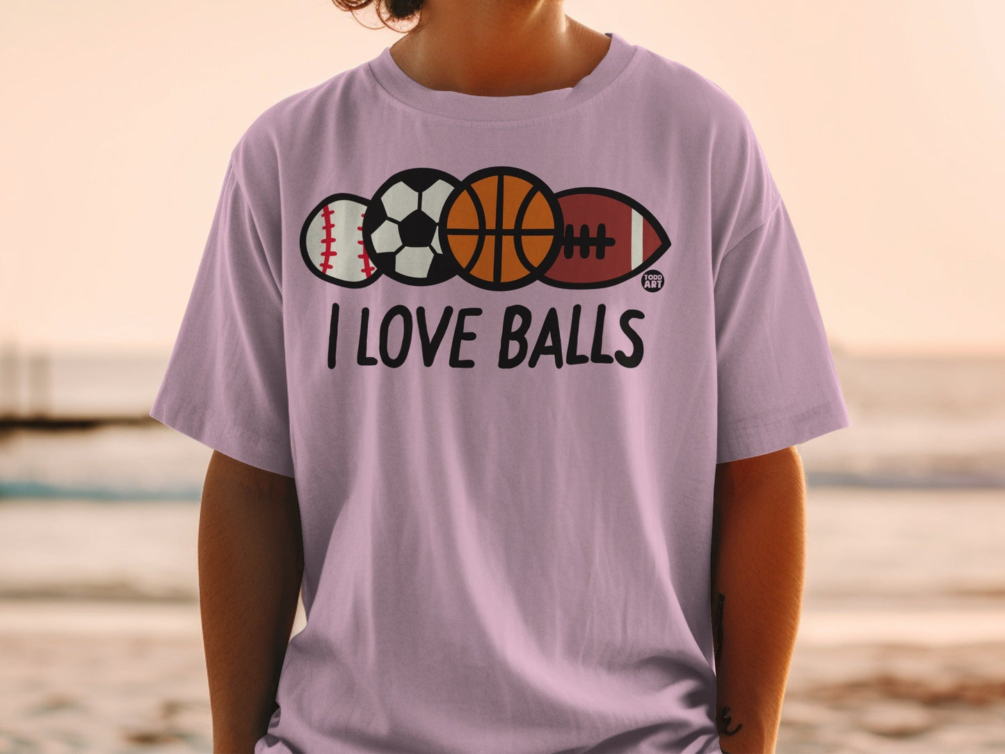 Purple t-shirt with "I LOVE BALLS" text and sports balls.
